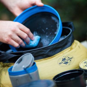 Always wash your dishes in a portable sink with biodegradable soap to protect the environment. Portable sink and camp soap available at Wilderness Supply