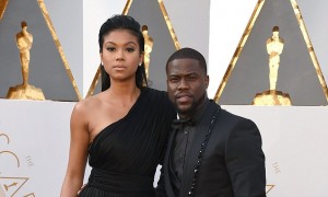 Eniko Parrish, left, and Kevin Hart arrive at the Oscars on Sunday, Feb. 28, 2016, at the Dolby Theatre in Los Angeles. (Photo by Jordan Strauss/Invision/AP)