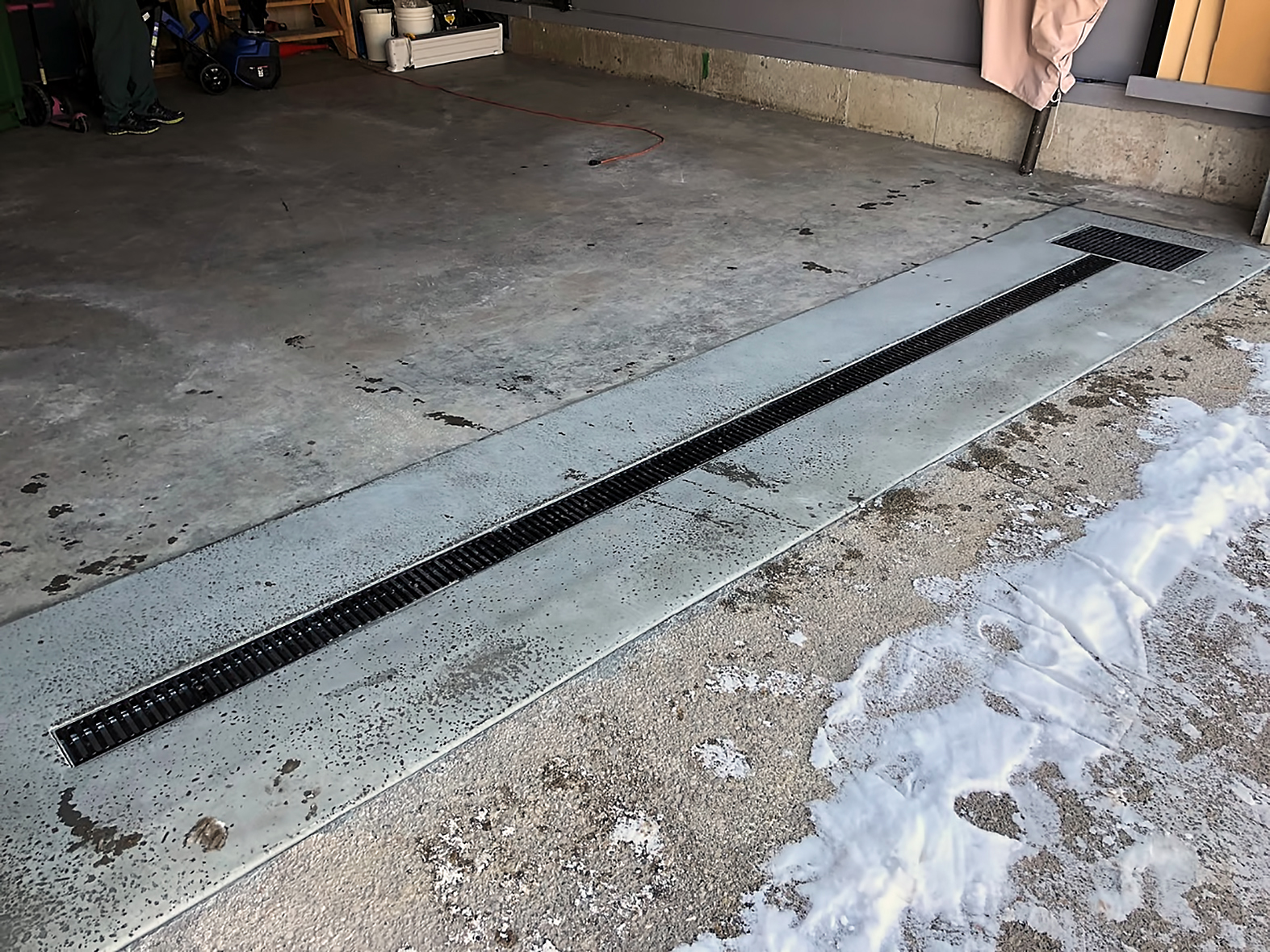 Garage floor hot sale drain system